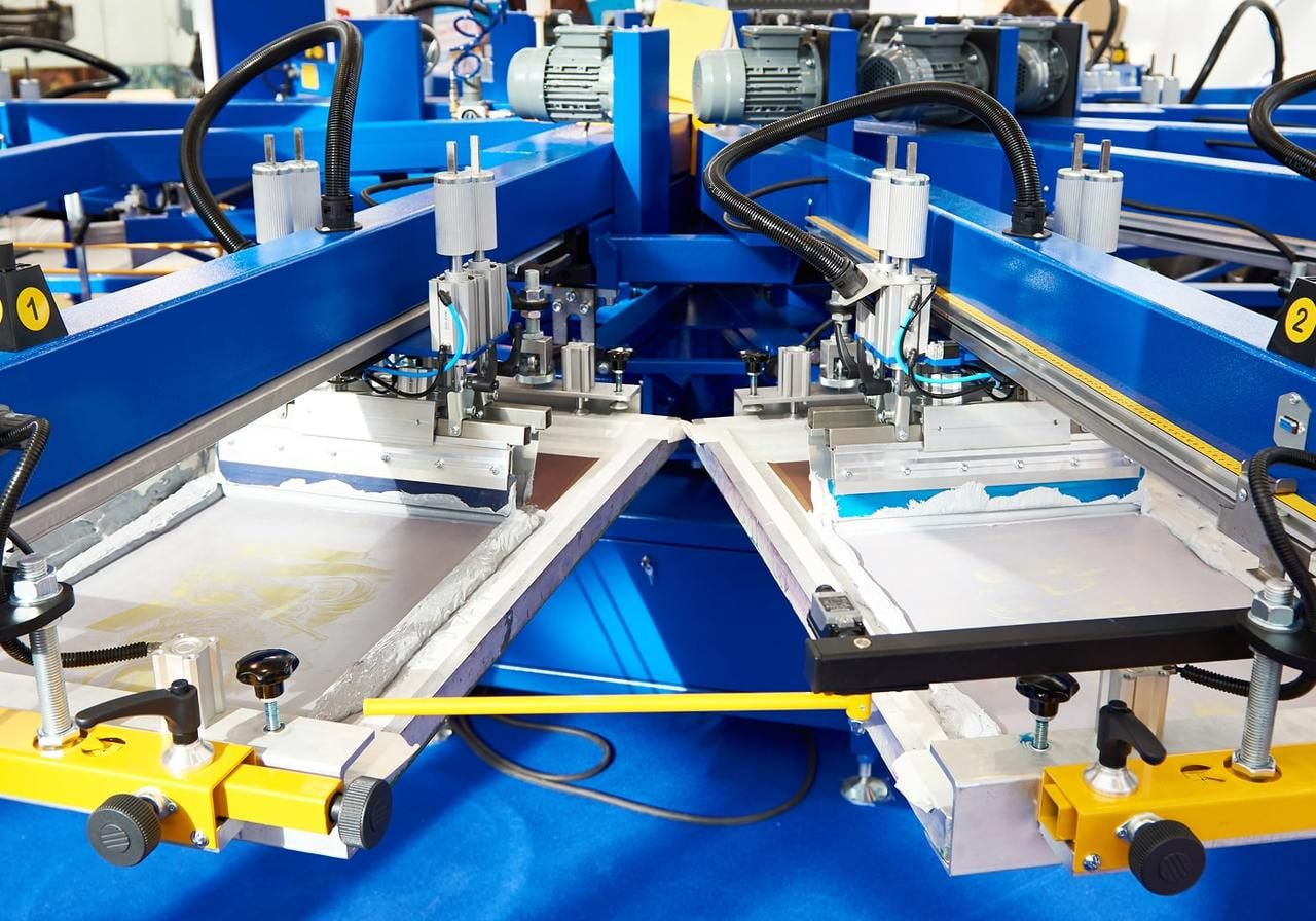 A large industrial screen printer.